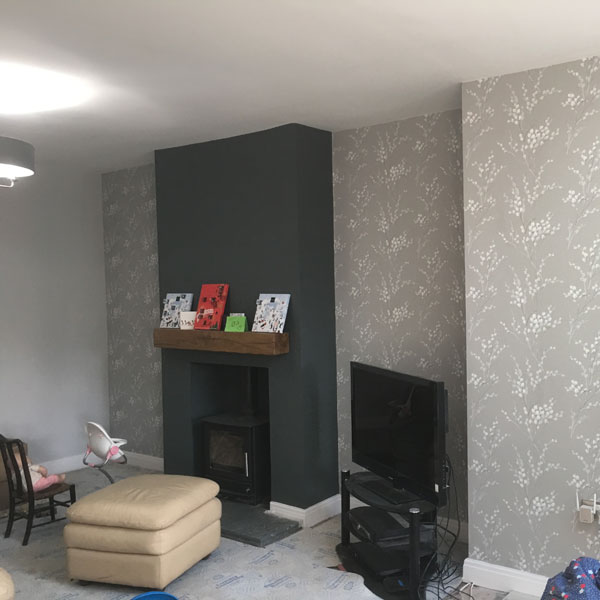 Wallpapered living room in Chester new build