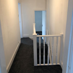 Staircase and landing decorated in Chester home